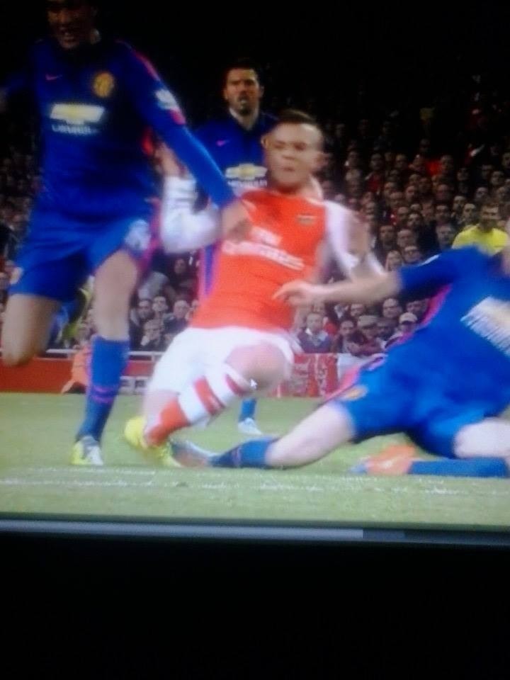 Wilshere being assaulted
